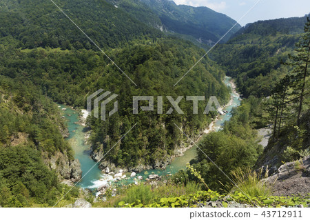 The pure turquoise water of the mountain river  43712911