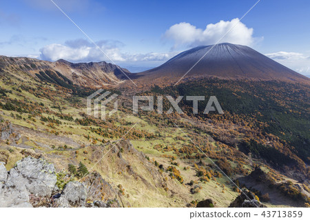 Amazing view of Mt. Asama with autumn leaves and snowfall Amazing view of Mt. Asama with autumn leaves and snowfall 43713859