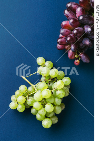 Bunches of red and green grapes. Bunches of red and green grapes. 43713908