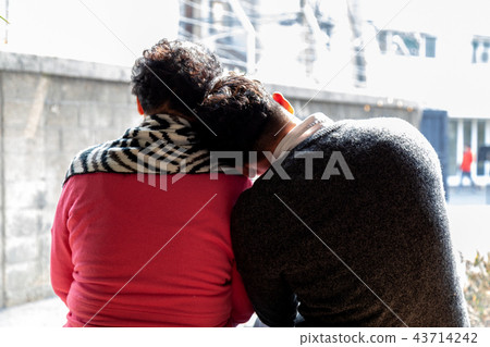 Son and mother talk to each other in a chair Son and mother talk to each other in a chair 43714242