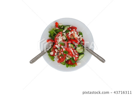 Shopska salad in a white plate isolated on white  43716311