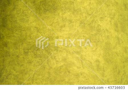 Yellow patterned surface of velvet fabric on top. Texture of artificial cloth Yellow patterned surface of velvet fabric on top. Texture of artificial cloth 43716603