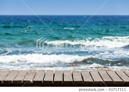 Wooden pier surface with blurred sea Wooden pier surface with blurred sea 43717311
