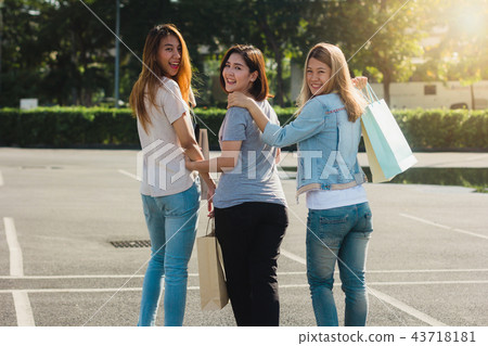 Woman shopping in market with shopping bags.  43718181