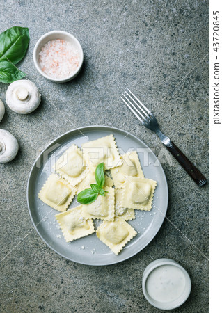 Ravioli with mushrooms and cheese 43720845