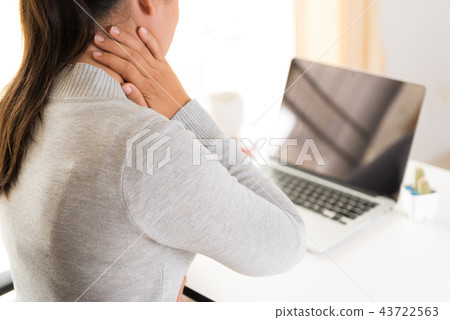 Closeup woman with hands holding her shoulder pain 43722563