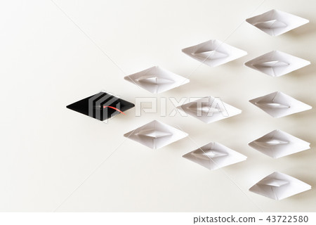 Black paper ship lead among white Black paper ship lead among white 43722580