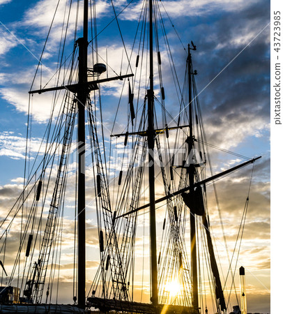 Mast and rope sailboat vessel on sunset background Mast and rope sailboat vessel on sunset background 43723985