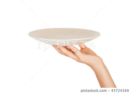 Blank empty round gray matte plate in female hand Blank empty round gray matte plate in female hand 43724169