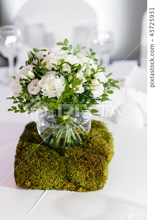 Beautiful and exquisite decoration of the wedding celebration. Flower arrangement of white flowers 43725931