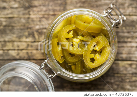 Slices of preserved Jalapeno pepper. 43726373