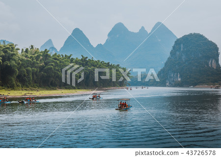 Scenic view of small tourist bamboo rafts sailing 43726578