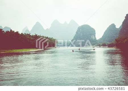 Scenic view of small tourist bamboo rafts sailing 43726581