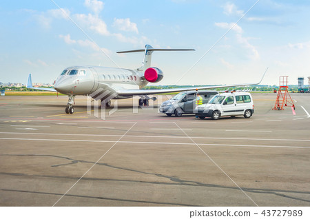 Airplane and cars at runway Airplane and cars at runway 43727989