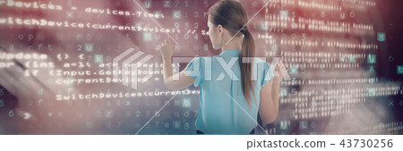 Composite image of rear view of businesswoman using imaginary interface 43730256