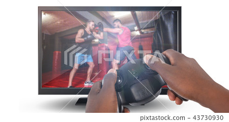 Composite image of hand of man playing video game against white background 43730930