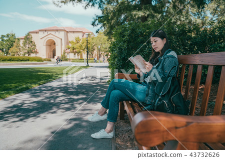 student reading book and sitting while waiting student reading book and sitting while waiting 43732626
