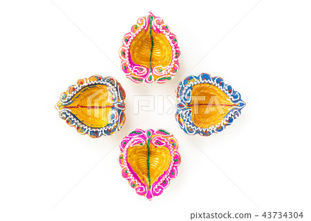 Happy Diwali - Clay Diya lamps lit during Dipavali Happy Diwali - Clay Diya lamps lit during Dipavali 43734304