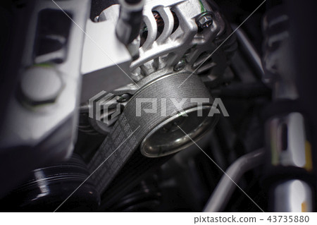 Timing belt of alternator in engine room of car. Timing belt of alternator in engine room of car. 43735880