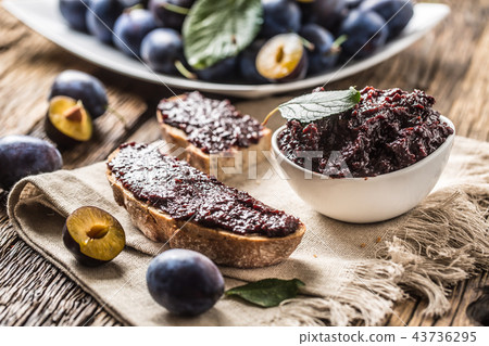 Breakfast from homemade plum jam and bread. Breakfast from homemade plum jam and bread. 43736295