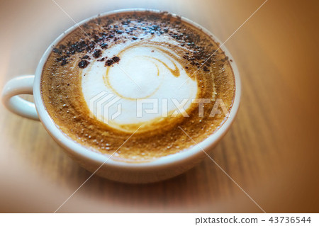 Top view a cup of cappuccino coffee with foam Top view a cup of cappuccino coffee with foam 43736544
