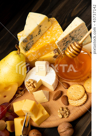 Different types of cheeses on a blackboard Different types of cheeses on a blackboard 43737142