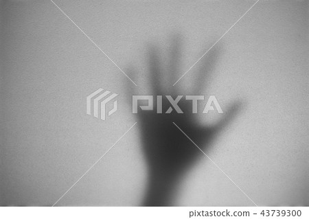 Shadow of hand the white frosted glass Shadow of hand the white frosted glass 43739300