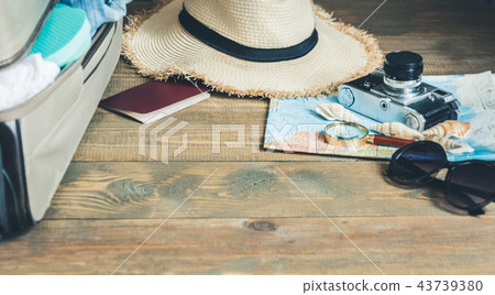 Open suitcase with female clothes on board. Open suitcase with female clothes on board. 43739380