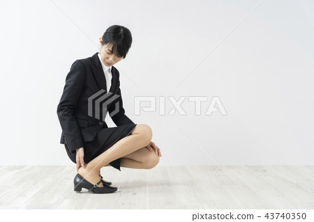 Female feet in a suit Female feet in a suit 43740350