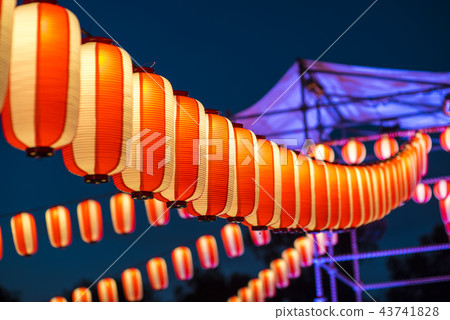 Orange paper lanterns strung in a line on festival Orange paper lanterns strung in a line on festival 43741828