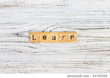 LEARN word written on wood block. LEARN word written on wood block. 43745094