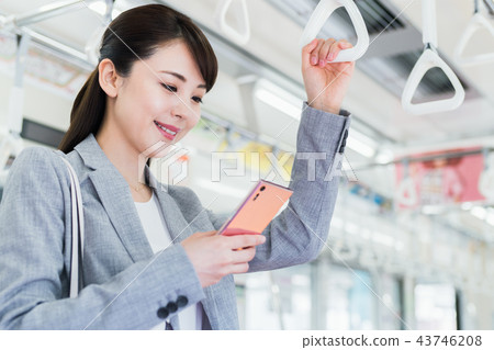 Business woman (commuting-train) photography cooperation "Keio Electric Railway Co., Ltd." Business woman (commuting-train) photography cooperation "Keio Electric Railway Co., Ltd." 43746208