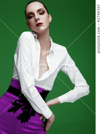 Fashion model wearing purple pants and white shirt 43746393