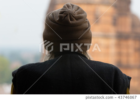 Indian person looking at temple, rear view, India. Indian person looking at temple, rear view, India. 43746867