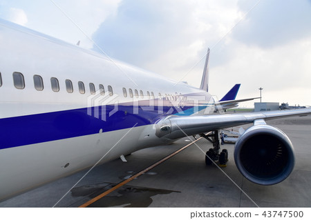Boarding an airplane Boarding an airplane 43747500