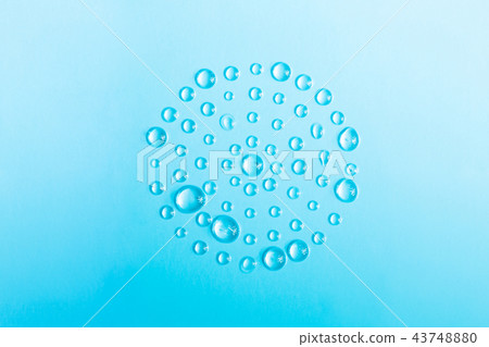 Circle of drops of water on a blue. 43748880