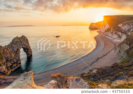 Landscape of empty Durdle Door beach at Sunset. Landscape of empty Durdle Door beach at Sunset. 43750310