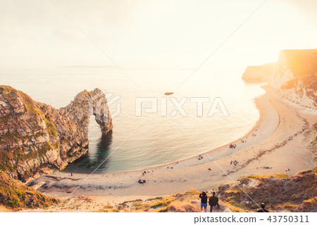Landscape of Durdle Door with tourists Landscape of Durdle Door with tourists 43750311