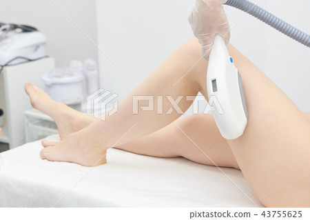Medical procedure. Laser hair removal. Female feet 43755625