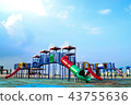 Colorful playground on blue sky background 43755636
