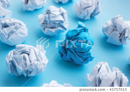 blue wrinkled ball of paper among the whites. blue wrinkled ball of paper among the whites. 43757015