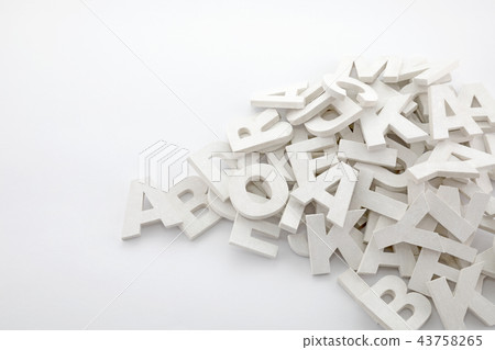 Pile of white painted wooden letters Pile of white painted wooden letters 43758265