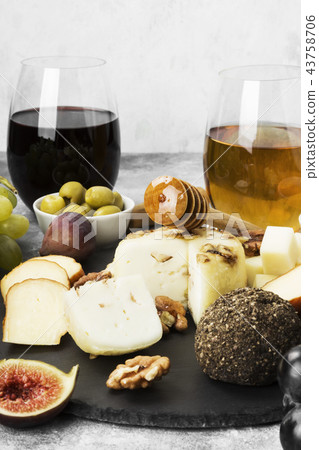 Snacks with wine - various types of cheeses, figs Snacks with wine - various types of cheeses, figs 43758706
