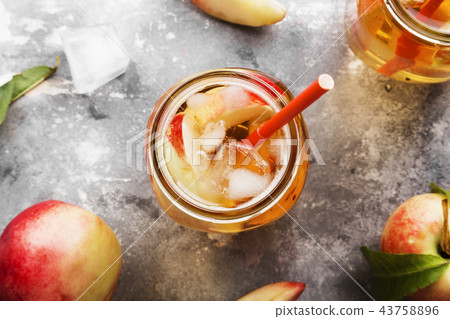 Peach ice tea on a gray background. Top view 43758896