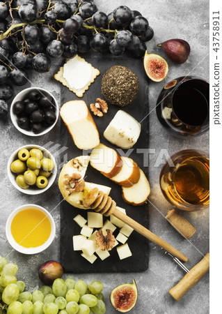 Snacks with wine - various types of cheeses, figs 43758911