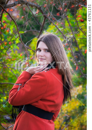 Young attractive woman in autumn day outdoors. 43761131