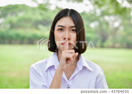Education Concepts. Beautiful student do not say (silent). Beaut Education Concepts. Beautiful student do not say (silent). Beaut 43764030