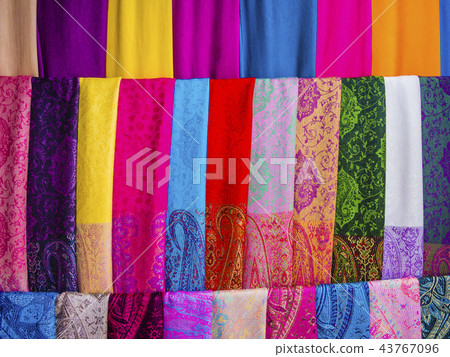 Silk scarvers hanging on market stall, Vietnam Silk scarvers hanging on market stall, Vietnam 43767096