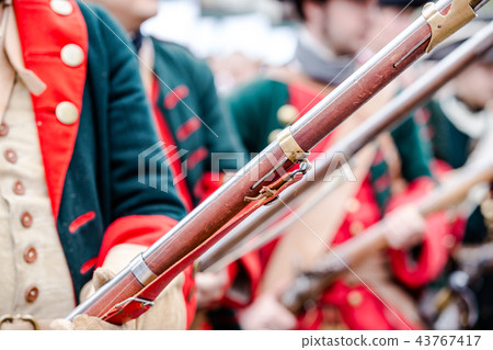 Building musketeers with guns. Focus on the gun 43767417