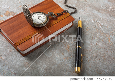 Diary with fountain pen and vintage pocket watch 43767959